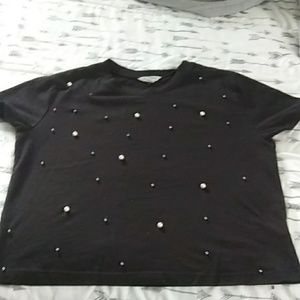 Black shirt with pearls on the front